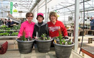 3 women making their own planters to bring home at Tree Top Nursery in Central MN